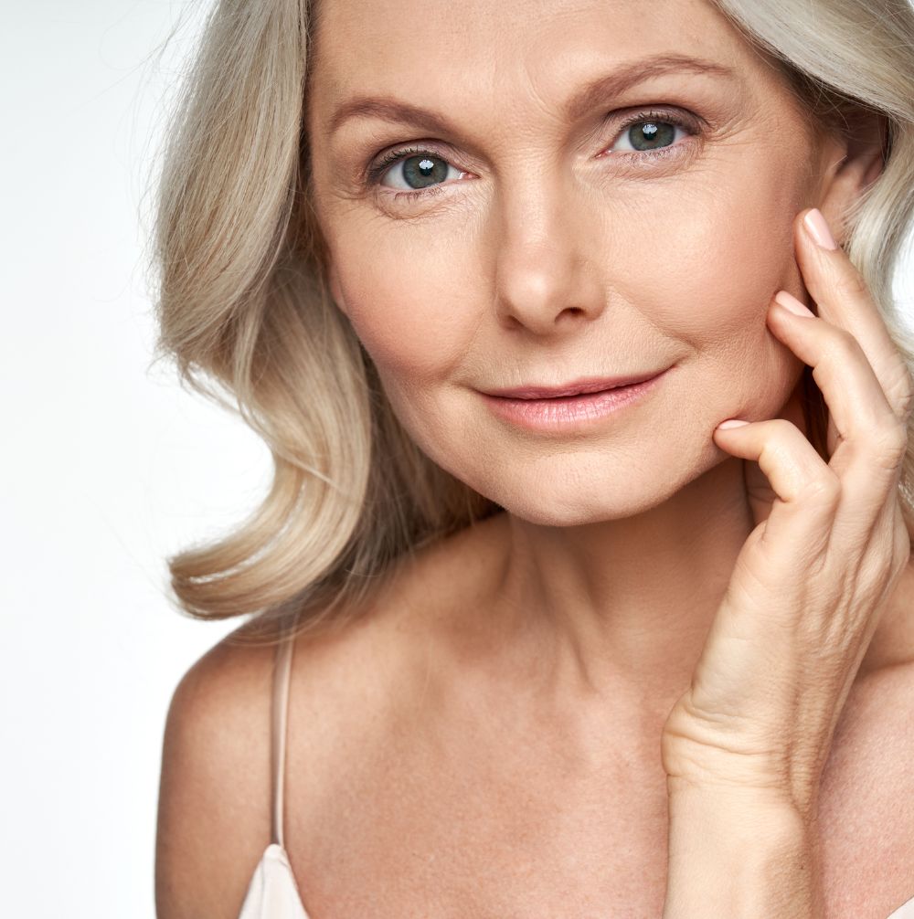 An older woman smiling after receiving Vascular Lesions & Laser Facials treatment