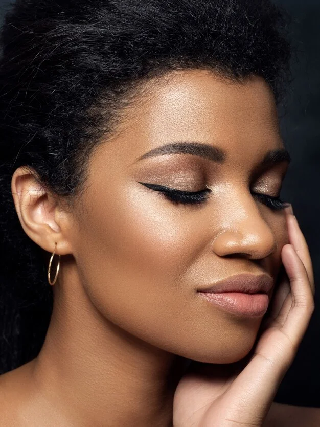 portrait young beautiful black woman touching her face