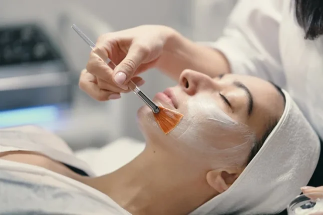 young woman getting chemical peel facials
