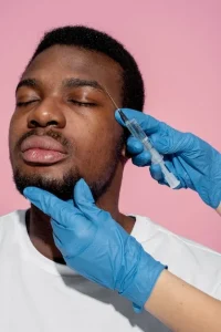 man getting botox anti aging treatment-