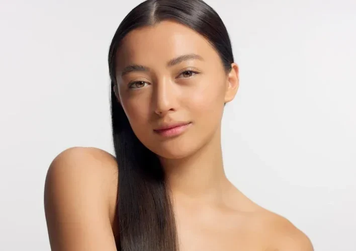 mixed-race-model-with-straight-hair-watching-camera-ideal-skin-natural-glowy-makeup-head-shoulders-crop